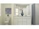 Bright bathroom with a double vanity, stylish decor, and modern fixtures at 4552 S 232Nd Dr, Buckeye, AZ 85326