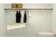 Spacious walk-in closet with organized hanging space, shelves, and storage baskets at 4552 S 232Nd Dr, Buckeye, AZ 85326