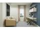 Bright office space featuring a built-in desk, comfortable seating, and modern decor at 4552 S 232Nd Dr, Buckeye, AZ 85326