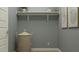 Functional laundry room with ample shelving, a woven basket, and neutral paint, creating an organized space at 4784 S 232Nd Ln, Buckeye, AZ 85326
