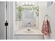 Cozy bathroom with leafy decor above a large mirror, a vanity, and floral accents for a fresh and inviting feel at 510 N Alma School Rd # 139, Mesa, AZ 85201