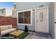 Inviting entrance with security door, and blue painted exterior with brick accent wall at 510 N Alma School Rd # 139, Mesa, AZ 85201