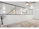 Spacious living room with large mirrored wall, ceiling fan and neutral flooring at 510 N Alma School Rd # 139, Mesa, AZ 85201