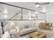 Bright and airy living room with mirrored accent wall, ceiling fan, and adjacent dining area at 510 N Alma School Rd # 139, Mesa, AZ 85201