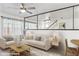 Bright and airy living room area with light wood floors and mirrored accent wall at 510 N Alma School Rd # 139, Mesa, AZ 85201