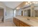 Bright bathroom featuring double sinks, soaking tub, and large mirror reflecting the bathroom's architecture at 510 W Marconi Ave, Phoenix, AZ 85023