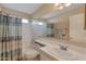 Bathroom with shower-tub combo and sink vanity that provides natural light at 510 W Marconi Ave, Phoenix, AZ 85023