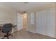 Bedroom featuring neutral carpet, closet space, and an attached room at 510 W Marconi Ave, Phoenix, AZ 85023