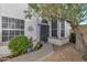 Inviting home entrance with desert landscaping, decorative shrubbery and secure steel screen door at 510 W Marconi Ave, Phoenix, AZ 85023