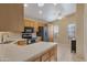 Bright kitchen boasts stainless steel appliances and a center island with counter seating at 510 W Marconi Ave, Phoenix, AZ 85023