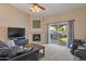 Inviting living room with a cozy fireplace, plush seating, and sliding door access to the backyard at 510 W Marconi Ave, Phoenix, AZ 85023
