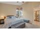 Inviting bedroom with plush bedding, ceiling fan, and lots of natural light at 510 W Marconi Ave, Phoenix, AZ 85023