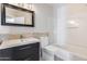 Bathroom with tile flooring, a vanity, toilet and shower-tub at 5729 S 21St Ter, Phoenix, AZ 85040