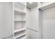 Bright, walk-in closet with multiple shelves and rods for ample storage space at 5729 S 21St Ter, Phoenix, AZ 85040