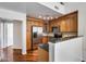 Kitchen with wooden cabinets, granite countertops, and stainless steel appliances at 5729 S 21St Ter, Phoenix, AZ 85040