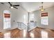 Open living space with abundant natural light, hardwood floors, and soaring vaulted ceiling at 5729 S 21St Ter, Phoenix, AZ 85040
