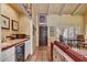 Entertaining room features a wet bar, tile floors, and stylish decor at 5738 N Scottsdale Rd, Scottsdale, AZ 85253
