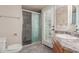 Bathroom featuring stone tiled shower and a single sink vanity at 6014 W Evans Dr, Glendale, AZ 85306