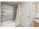 Bathroom featuring stone tiled shower and a single sink vanity at 6014 W Evans Dr, Glendale, AZ 85306
