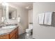 Bathroom featuring single sink vanity, tile floors, and standard toilet at 6014 W Evans Dr, Glendale, AZ 85306