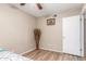 Bedroom with neutral walls and wood-look laminate flooring at 6014 W Evans Dr, Glendale, AZ 85306