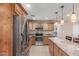Spacious kitchen featuring stainless steel appliances, tile floors and an oversized kitchen island at 6014 W Evans Dr, Glendale, AZ 85306