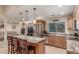 Well-lit kitchen featuring stainless steel appliances, a functional island, and plenty of storage at 6014 W Evans Dr, Glendale, AZ 85306