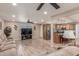 Comfortable living space with ceiling fan, sleek wood-look flooring, and an open layout at 6014 W Evans Dr, Glendale, AZ 85306