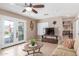 Inviting living room boasts a television, neutral walls, stylish decor, and doors leading to a pool view at 6014 W Evans Dr, Glendale, AZ 85306