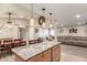Open floor plan with spacious kitchen island overlooking the living room at 6014 W Evans Dr, Glendale, AZ 85306