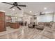 Open-concept living area showcases a modern ceiling fan, spacious layout, and seamless flooring at 6014 W Evans Dr, Glendale, AZ 85306