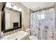 Comfortable bathroom with vanity, toilet, mirror, shower and tub combination, and tile flooring at 609 E Winter Dr, Phoenix, AZ 85020
