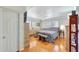 Cozy bedroom with hardwood floors, a ceiling fan, and plantation shutters at 609 E Winter Dr, Phoenix, AZ 85020
