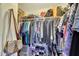 Inside an organized walk-in closet with clothing, bags, and shoes neatly arranged at 609 E Winter Dr, Phoenix, AZ 85020