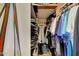 An organized walk-in closet featuring shelving, clothing, shoes, and personal items at 609 E Winter Dr, Phoenix, AZ 85020