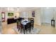 Open concept dining room with views into the living room with dark wood furniture at 609 E Winter Dr, Phoenix, AZ 85020