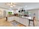 Well-lit kitchen with white cabinetry, granite countertops, and modern appliances at 609 E Winter Dr, Phoenix, AZ 85020