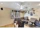 Comfortable living room featuring neutral paint, a sofa, shelving, and modern floors at 609 E Winter Dr, Phoenix, AZ 85020