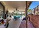 Covered patio with dining area overlooking the pool, ideal for entertaining at 609 E Winter Dr, Phoenix, AZ 85020