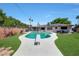 Backyard oasis with pool, diving board, and solar panels at 609 E Winter Dr, Phoenix, AZ 85020