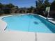 Backyard pool view with basketball hoop and solar panels on the roof at 609 E Winter Dr, Phoenix, AZ 85020
