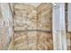 The tiled shower stall features brown tiles, a handheld shower head, and a shower curtain at 609 E Winter Dr, Phoenix, AZ 85020