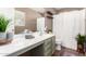 Tastefully designed bathroom with modern vanity, neutral tones, and decorative shelving at 6343 W Sophie Ln, Laveen, AZ 85339