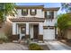 Charming two-story home with a tile roof, covered porch, and a well-maintained desert landscape at 6343 W Sophie Ln, Laveen, AZ 85339