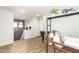 Bright hallway with wood-look floors, complemented by natural light and stylish decor at 6343 W Sophie Ln, Laveen, AZ 85339