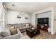 Cozy living room features a large sectional, wood floors, recessed lighting, and decor shelves at 6343 W Sophie Ln, Laveen, AZ 85339