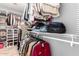 Spacious walk-in closet with ample shelving, hanging space, and dedicated shoe storage at 6343 W Sophie Ln, Laveen, AZ 85339