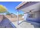 View of the covered back patio with ceiling fan and a low maintenance gravel yard at 6428 W Cordes Rd, Phoenix, AZ 85043