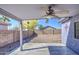 Covered back patio with ceiling fan overlooking a low maintenance gravel yard at 6428 W Cordes Rd, Phoenix, AZ 85043