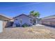 View of the backyard with covered patio and low maintenance desert landscaping at 6428 W Cordes Rd, Phoenix, AZ 85043